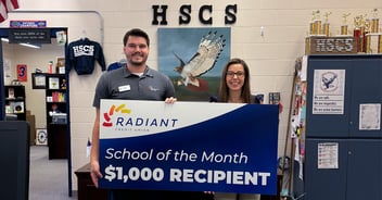 Thomas Jackson presenting check to Heather Harbour.