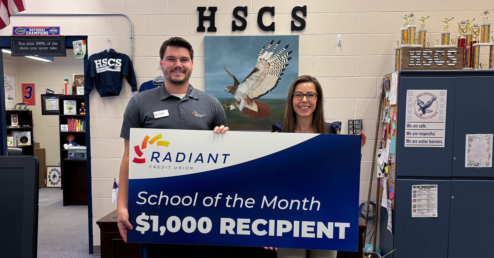 Thomas Jackson presenting check to Heather Harbour.